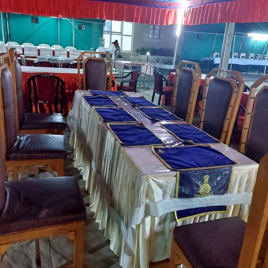 Formal banquet table styled with blue and gold table runners