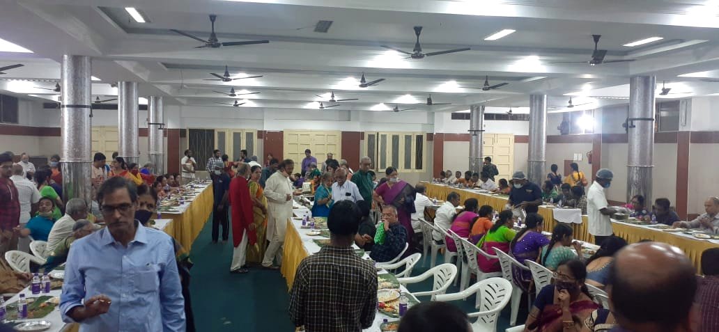 Guests dining at a large indoor banquet hall function