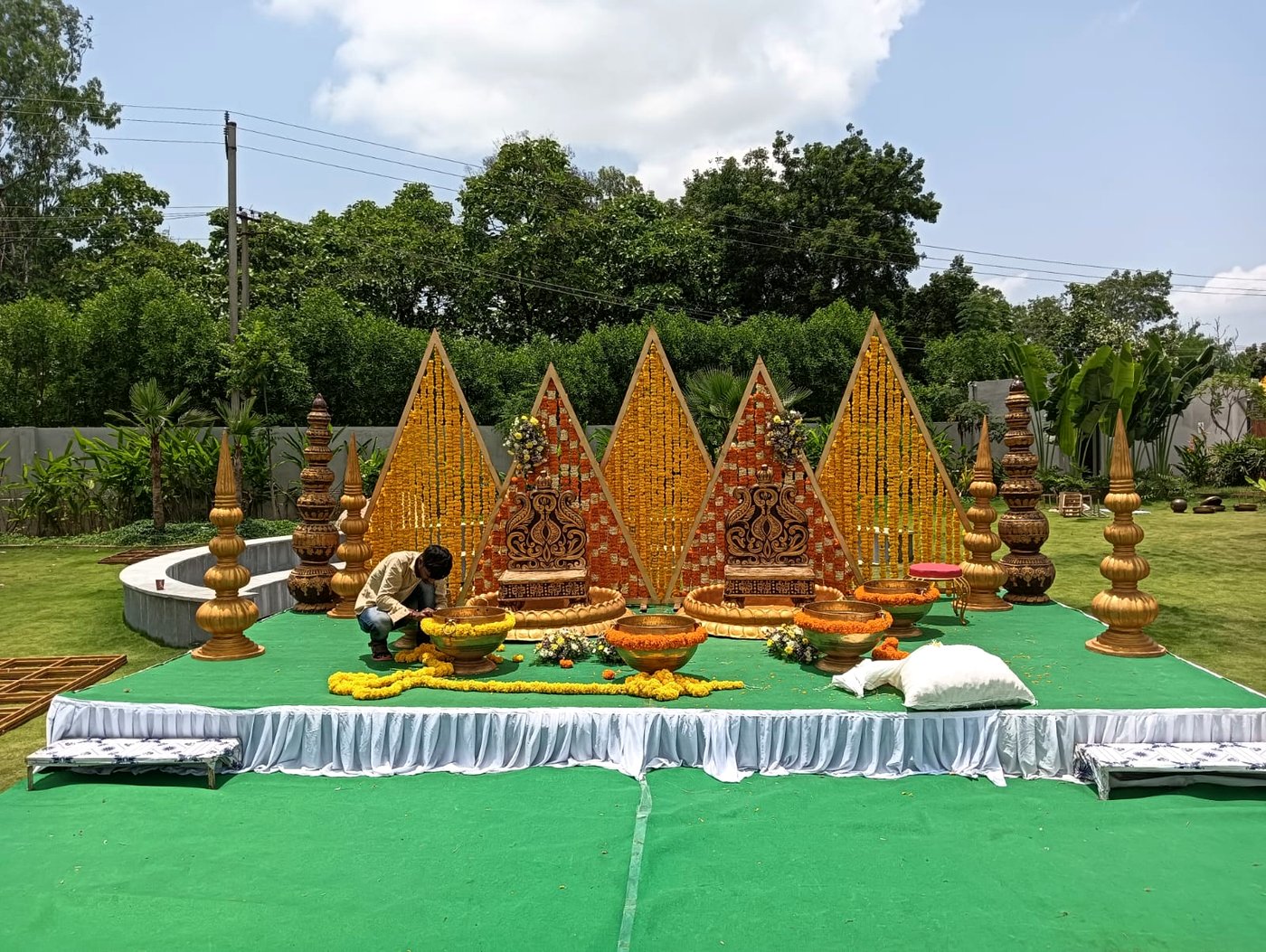 Marigold mandap floral decor set up for a wedding ceremony